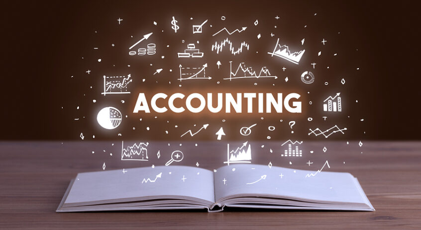 ACCOUNTING inscription coming out from an open book, business co
